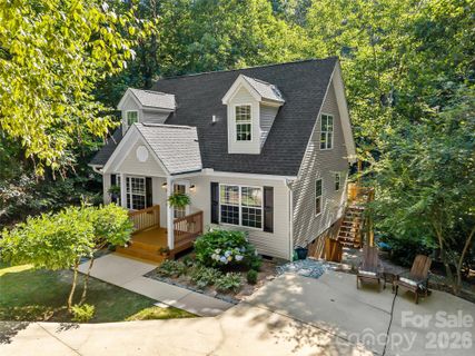 53 Honeysuckle Ridge Road active home in Knob Creek, Pisgah Forest, NC
