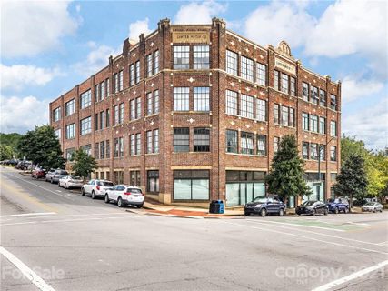 100 Coxe Avenue Unit 409 sold home in Sawyer Motor Building, Asheville, NC